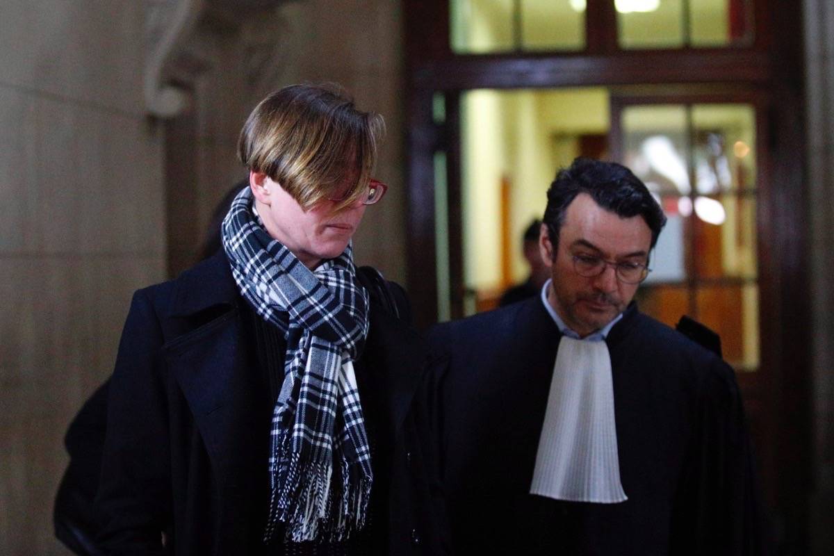 Emily Spanton from Canada arrives with her lawyer at court in Paris, Monday, Jan. 14, 2019. (AP Photo/Francois Mori)