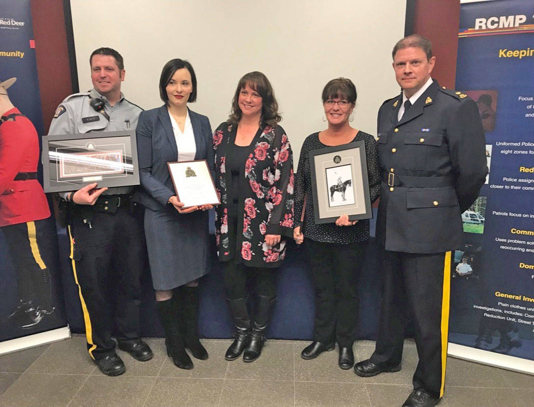 From left Const. Sean Morris, Brittany Ashmore, Corp. Karyn Kay, Kimberly Haugen and Insp. Gerald Grobmeier pose for a picture during a community recognition event Feb. 7th. Mark Weber/Red Deer Express