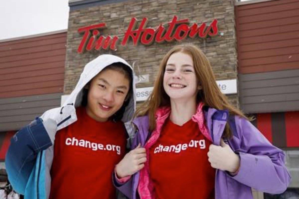 Mya Chau and Eve Helman, both 12, and Ben Duthie, 16, are behind a change.org petition asking Canada’s iconic coffee chain to introduce a fully compostable or recyclable paper cup. (The Canadian Press)