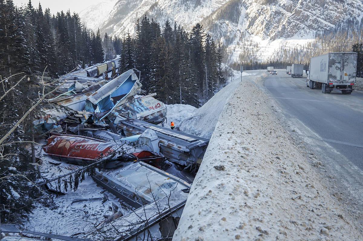A union representative says a Canadian Pacific freight train fell more than 60 metres from a bridge near the Alberta-British Columbia boundary in a derailment that killed three crew members. The westbound freight jumped the tracks Monday at about 1 a.m. near Field, B.C. (Jeff McIntosh/The Canadian Press)