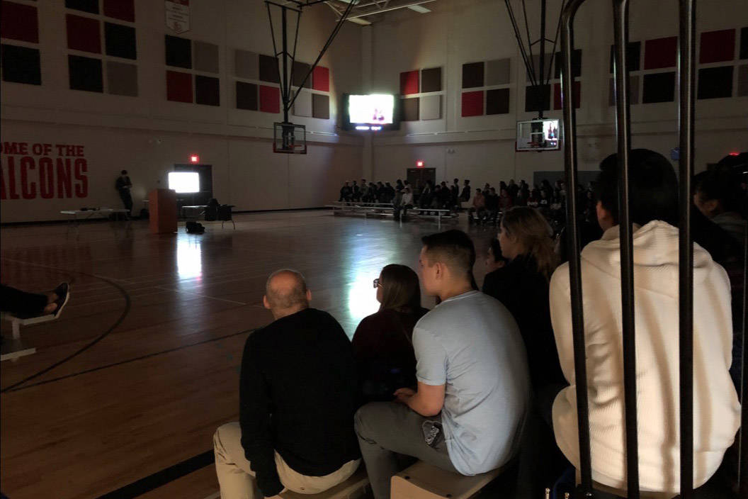 St. Joseph High School students watch a video as part of the Drive to Stay Alive presentation by professional race car driver and Red Deer native Parker Thompson. Robin Grant/Red Deer Express