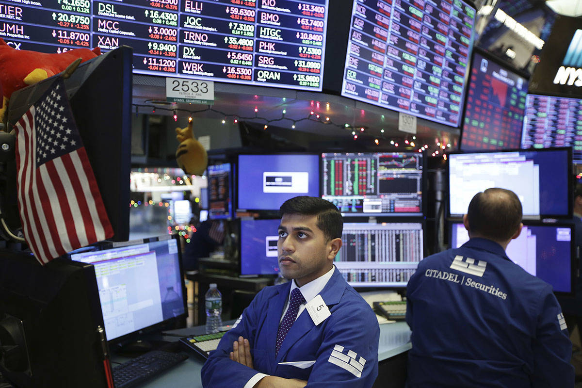 Traders work on the floor of the New York Stock Exchange in New York, Monday, Dec. 24, 2018. (AP Photo/Seth Wenig)