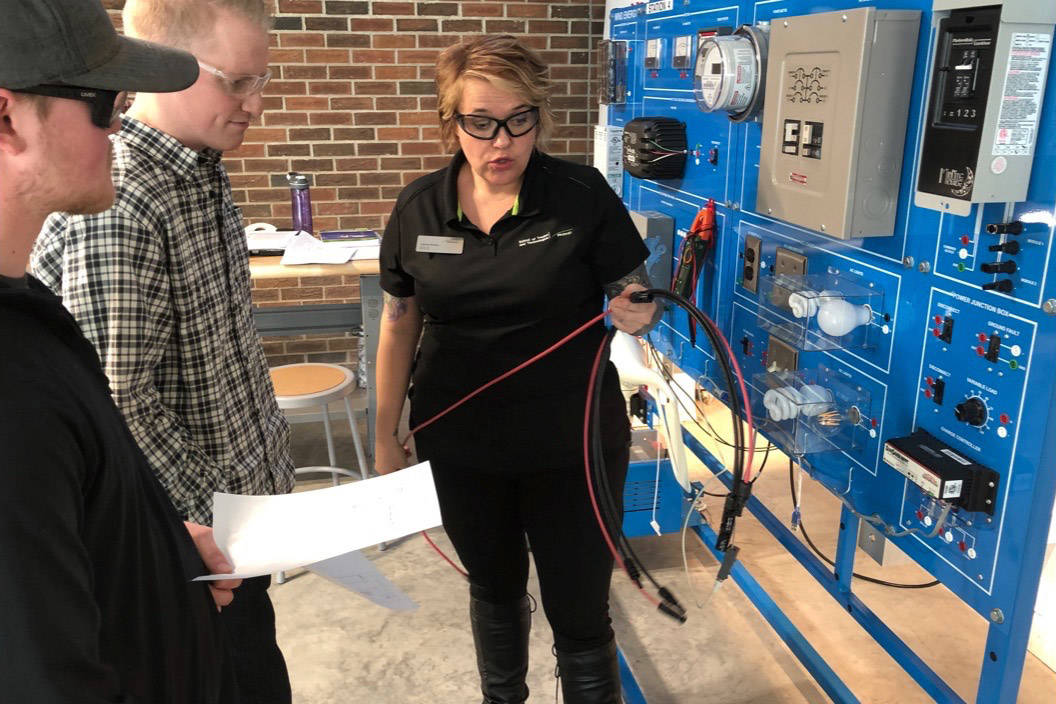 Joanne Greene, an electrical instructor with Red Deer College, shows students how a solar panel supplies power to LED lights and a battery at the newly opened RDC Alternative Energy Lab. Robin Grant/Red Deer Express
