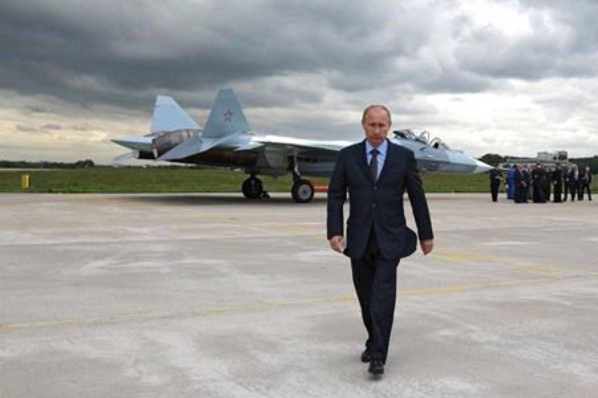 Russian Prime Minister Vladimir Putin walks after inspecting a new Russian fighter jet after its test flight in Zhukovksy, outside Moscow, Russia, on June 17, 2010. New Russian moves in the Arctic have renewed debate over that country’s intentions and Canada’s own status at the top of the world. Late last month, the Russian newspaper Izvestia reported that country’s military will resume fighter patrols to the North Pole for the first time in 30 years. Those patrols will be in addition to regular bomber flights up to the edge of U.S. and Canadian airspace. (RIA Novosti, Alexei Druzhinin, Government Press Service/The Canadian Press)
