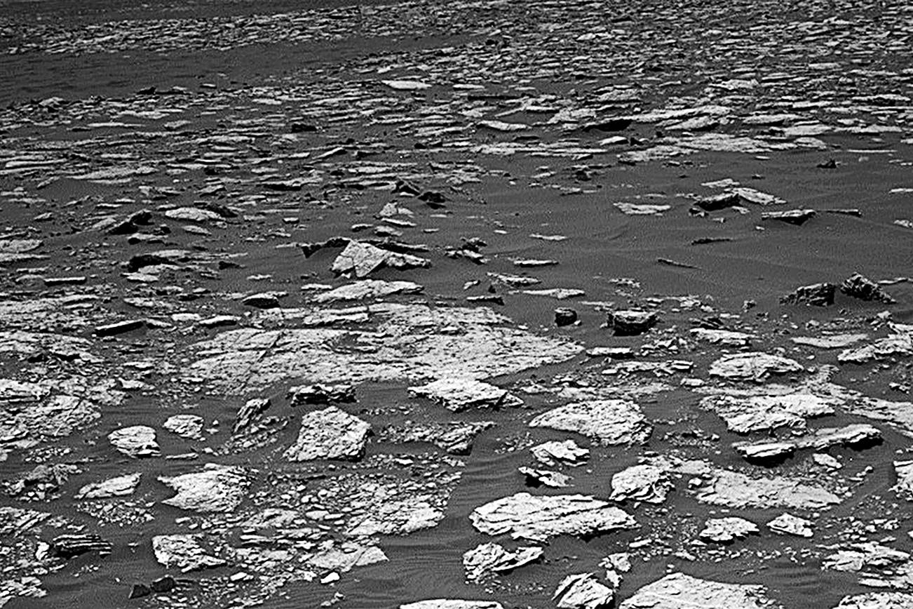 This Dec. 2, 2016 image taken by NASA’s Curiosity rover shows rocky ground on the lower flank of Mount Sharp, a mountain on Mars. Curiosity landed on the red planet in 2012 and uncovered geologic evidence of an ancient environment that could have supported primitive life early in the red planet’s history. (NASA via AP)