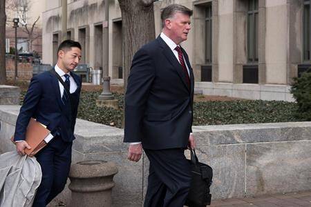 Kevin Downing, Paul Manafort’s defense attorney, right, walks to the entrance of federal court on Wednesday, Feb. 13, 2019 in Washington. (AP Photo/Kevin Wolf)