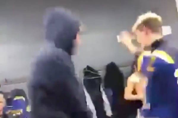 A screenshot of a video showing members of a Fort McMurray minor hockey team dancing in the locker room. (Facebook)