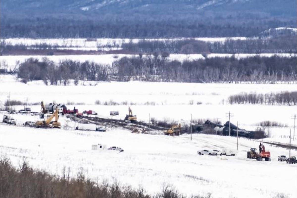Excavators work at the site of a train derailment ten-kilometres south of St. Lazare, Man. on Saturday February 16, 2019. (Michael Bell/The Canadian Press)