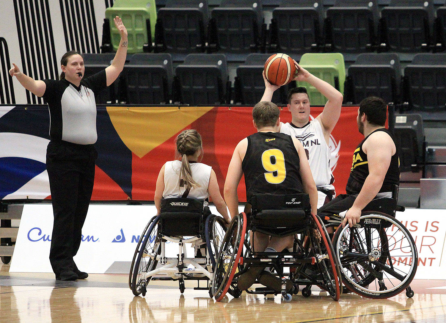 Newfoundland and Labrador’s Nick Power looks to inbound the ball against some pressure from Manitoba in the first quarter of their consolation round wheelchair basketball game Feb. 20th. Manitoba went on to win 47-22 at the G.W. Harris Canada Games Centre. Photo by Jordie Dwyer