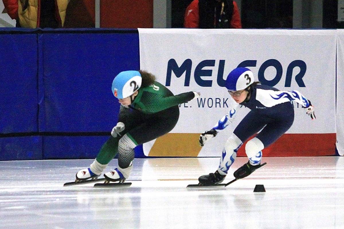 Cezara Bere of Alberta races to the finish line with Prince Edward Island’s Jenna Larter for second in this 500m Short Track Speed Skating quarterfinal Feb. 20th at the Gary W. Harris Canada Games Centre. Bere would outstretch Larter for a spot in the semi-finals by 0.002 seconds. Photo by Jordie Dwyer/Black Press News Services