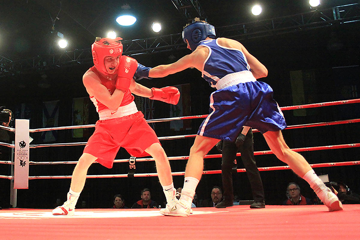 Albertas Kyle Oliver, in red, battles for bronze with Christopher Lucas Craston of Ontario in the 60kg boxing event at Westerner Park Feb. 20th. Oliver would lose the bout on points. Photos by Jordie Dwyer/Black Press News Services