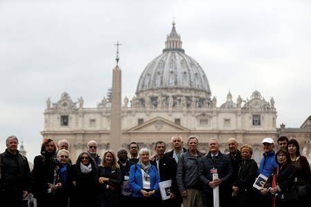 Members of the Ending of Clergy Abuse organization and survivors of clergy sex abuse pose for photographers outside St. Peter’s Square, at he Vatican, Monday, Feb. 18, 2019. (AP Photo/Gregorio Borgia)