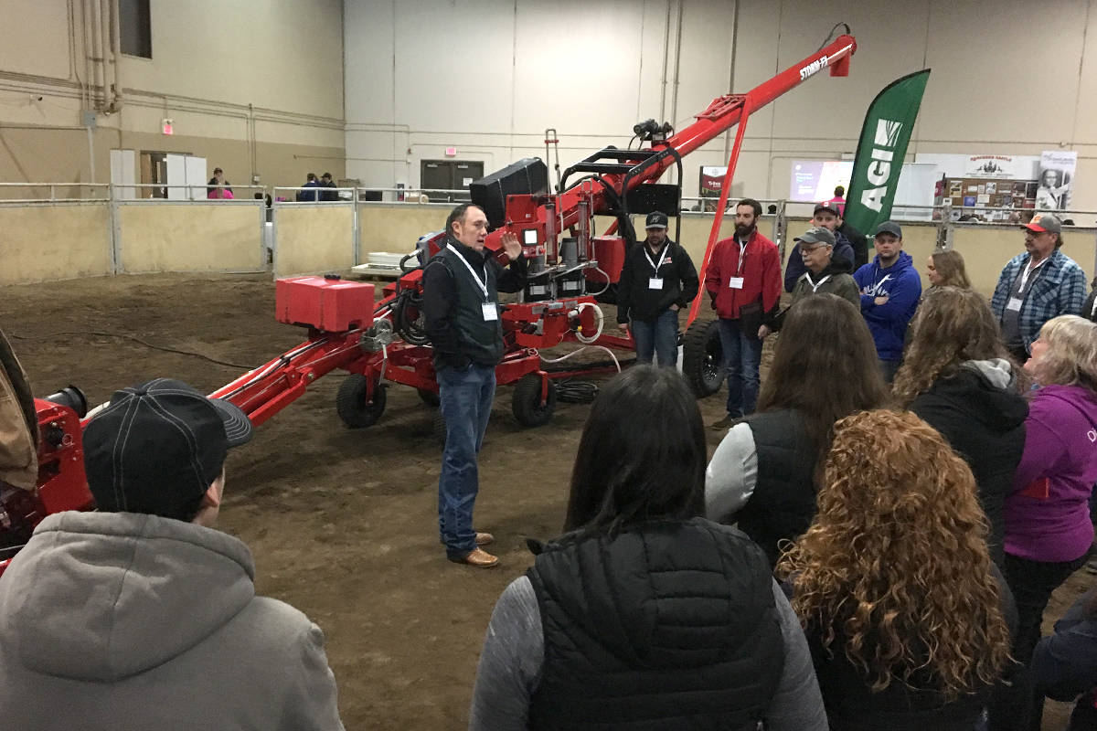 Blake Taylor, territory sales representative with AGI speaks to attendees of a Bayer Crop Science trade show at the Calnash Ag Event Centre Feb. 21. The trade show is about working closely with seed science while also working with industry partners.                                Photo by Jeffrey Heyden-Kaye
