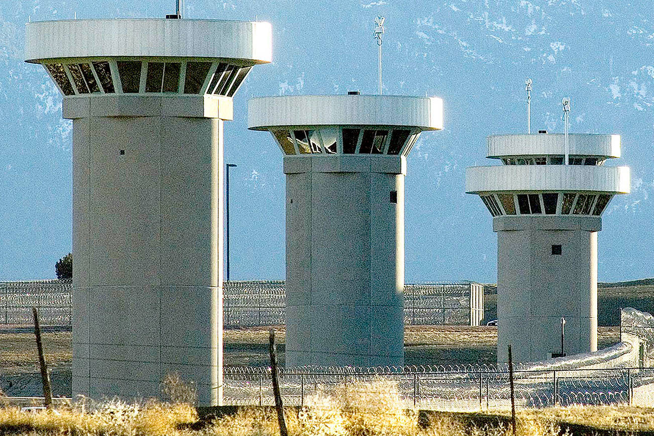 FILE - In this Feb. 21, 2007, file photo, guard towers loom over the administrative maximum security federal prison called Supermax near Florence, Colo. Experts say the drug lord Joaquin “El Chapo” Guzman, who will be sentenced on June 25, 2019, for smuggling enormous amounts of narcotics into the U.S and having a hand in dozens of murders, seems the ideal candidate for “Supermax” prison also known as ADX for “administrative maximum,” a facility so secure, so remote and so austere that it has been called the “Alcatraz of the Rockies.” (Chris McLean/The Pueblo Chieftain via AP)