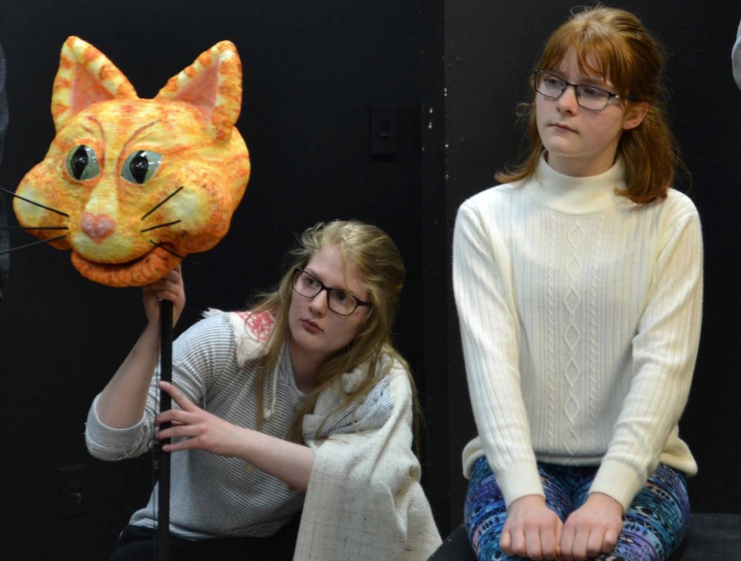 From left, Brooklyn Young (Cheshire cat) and Mackenzie Hudson (Alice) rehearse a scene from Tree House Youth Theatre’s coming production of Alice in Wonderland. The Cheshire cat was designed by Heather Cornick.                                Albertus Koett photo