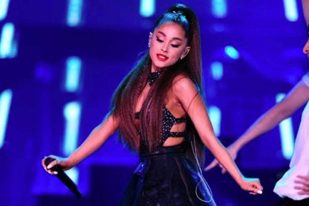 FILE - In this June 2, 2018 file photo., Ariana Grande performs at Wango Tango at Banc of California Stadium in Los Angeles. Grande is returning to Manchester, two years after a suicide bomber killed 22 people at her concert in the northwest England city. Organizers say Grande will be a headliner at the Manchester Pride Live event on Aug. 25.(Photo by Chris Pizzello/Invision/AP, File)