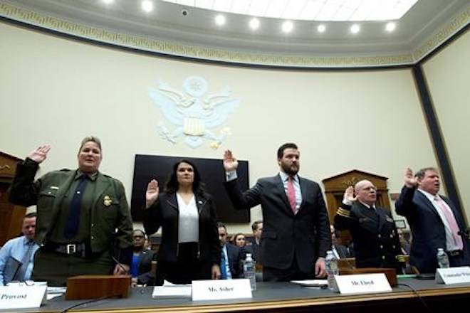 From left, U.S. Border Patrol, Customs and Border Protection Chief Carla Provost, Acting Executive Associate Director on Immigration and Customs Enforcement Operations Nathalie R. Asher, Senior Adviser Department of Health and Human Services Scott Lloyd, U.S. Public Health Service Commissioned Corps Commander Jonathan White and Department of Justice Director of Executive Office for Immigration Review James McHenry are sworn-in Tuesday, Feb. 26, 2019. (AP Photo/Jose Luis Magana)