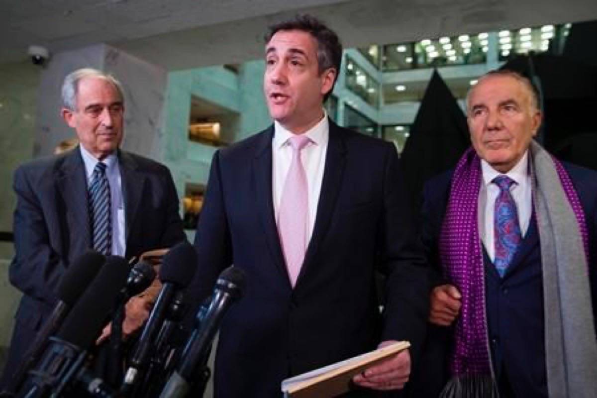 Michael Cohen, center, President Donald Trump’s former lawyer, speaks as he departs after testifying before a closed door hearing of the Senate Intelligence Committee accompanied by his lawyers, Lanny Davis, left, of Washington, and Michael Monico of Chicago, on Capitol Hill, Tuesday, Feb. 26, 2019, in Washington. (AP Photo/Alex Brandon)