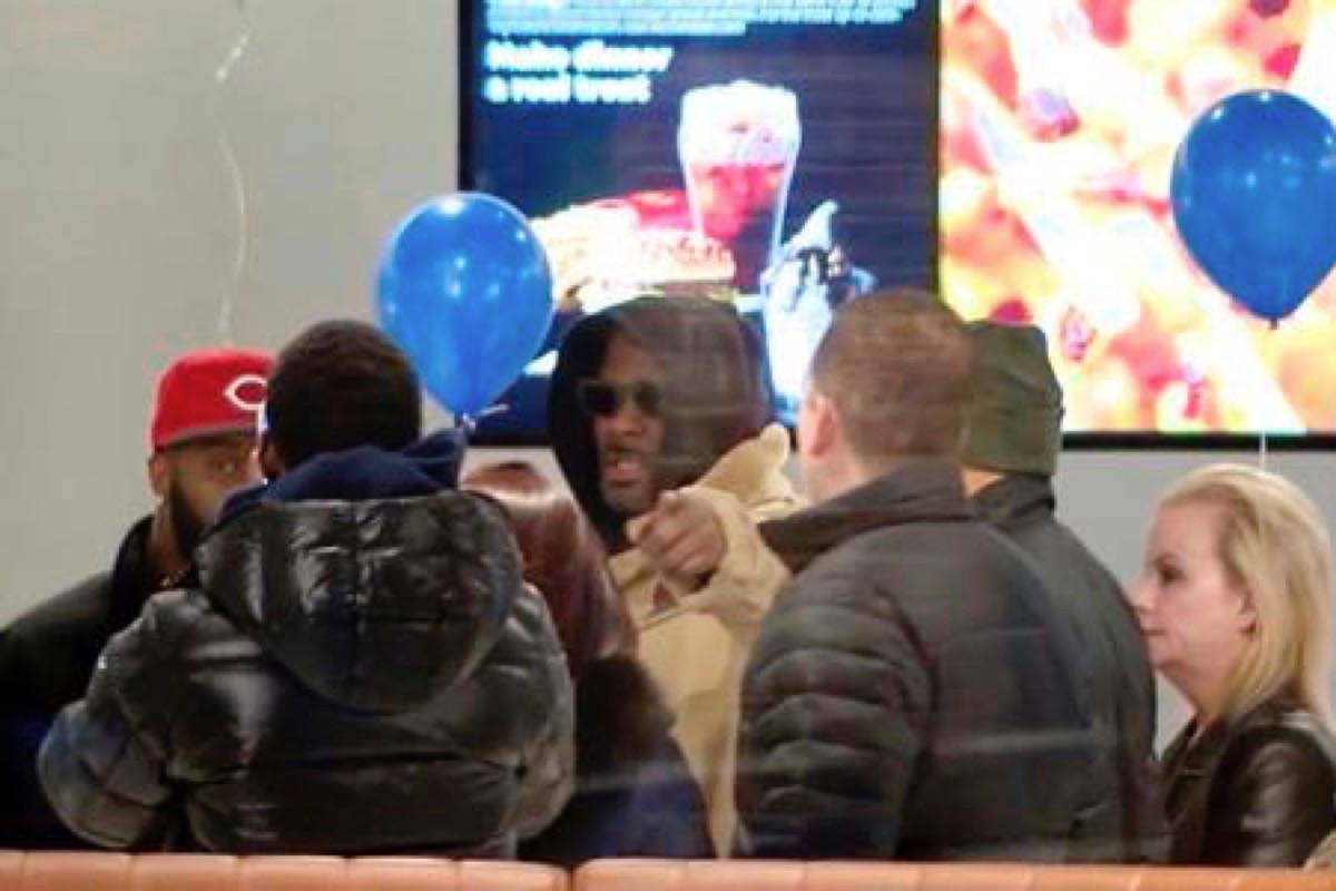 In this image made from a video, R. Kelly stops at a McDonald’s restaurant in Chicago Monday, Feb. 25, 2019, after a suburban Chicago woman posted the $100,000 bail for him to be freed from jail while he awaits trial on sexual abuse charges. R. Kelly signed autographs and waved at a fan who yelled “I love you!” when he stopped at McDonald’s in downtown Chicago. (WFLD via AP)