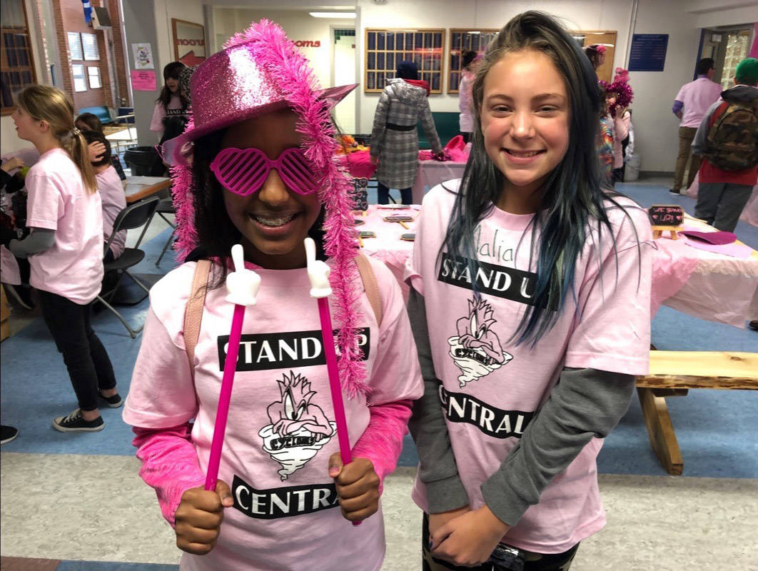 Grade 6 students Hanan Henlk and Malia Mitchelmore dressed in pink for Pink Shirt Day at Central Middle School on Wednesday. Robin Grant/Red Deer Express