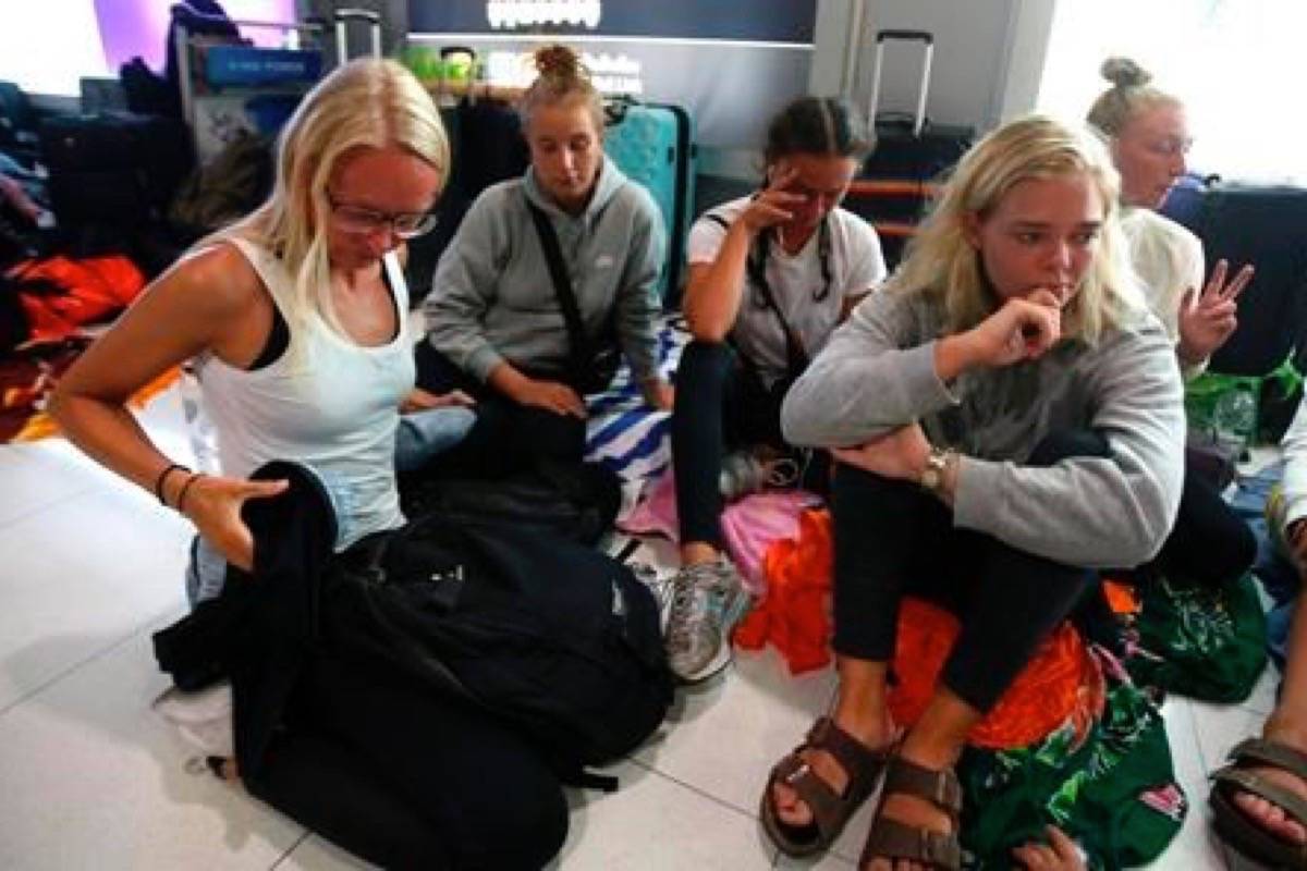 A group of 25 Danish students stay overnight at Suvarnabhumi Airport after they were unable to board a connecting flight Thursday, Feb. 28, 2019, in Bangkok, Thailand. A temporary closure of air space over Pakistan snarled air traffic Thursday, especially between Asia and Europe, though some airlines adjusted by rerouting their flights. (AP Photo/Sakchai Lalit)