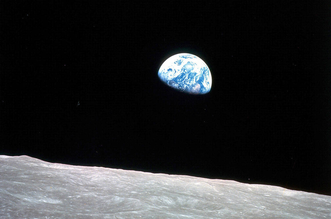 FILE - This Dec. 24, 1968, file photo made available by NASA shows the Earth behind the surface of the moon during the Apollo 8 mission. (William Anders/NASA via AP, File)