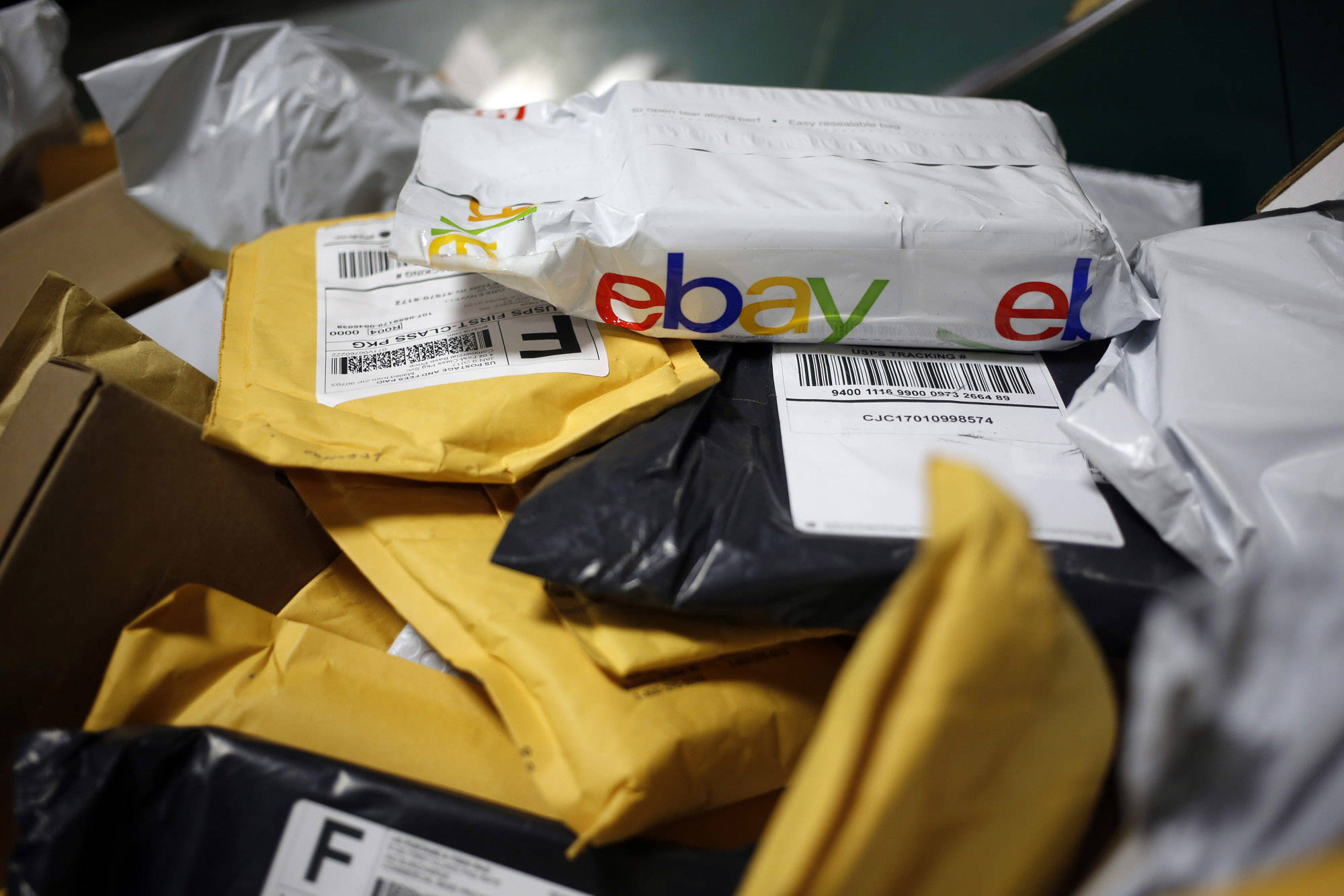 A parcel in eBay Inc. packaging is seen on a conveyor belt with other small parcels at the United States Postal Service sorting center in Louisville, Kentucky, on Jan. 13, 2017. MUST CREDIT: Bloomberg photo by Luke Sharrett.