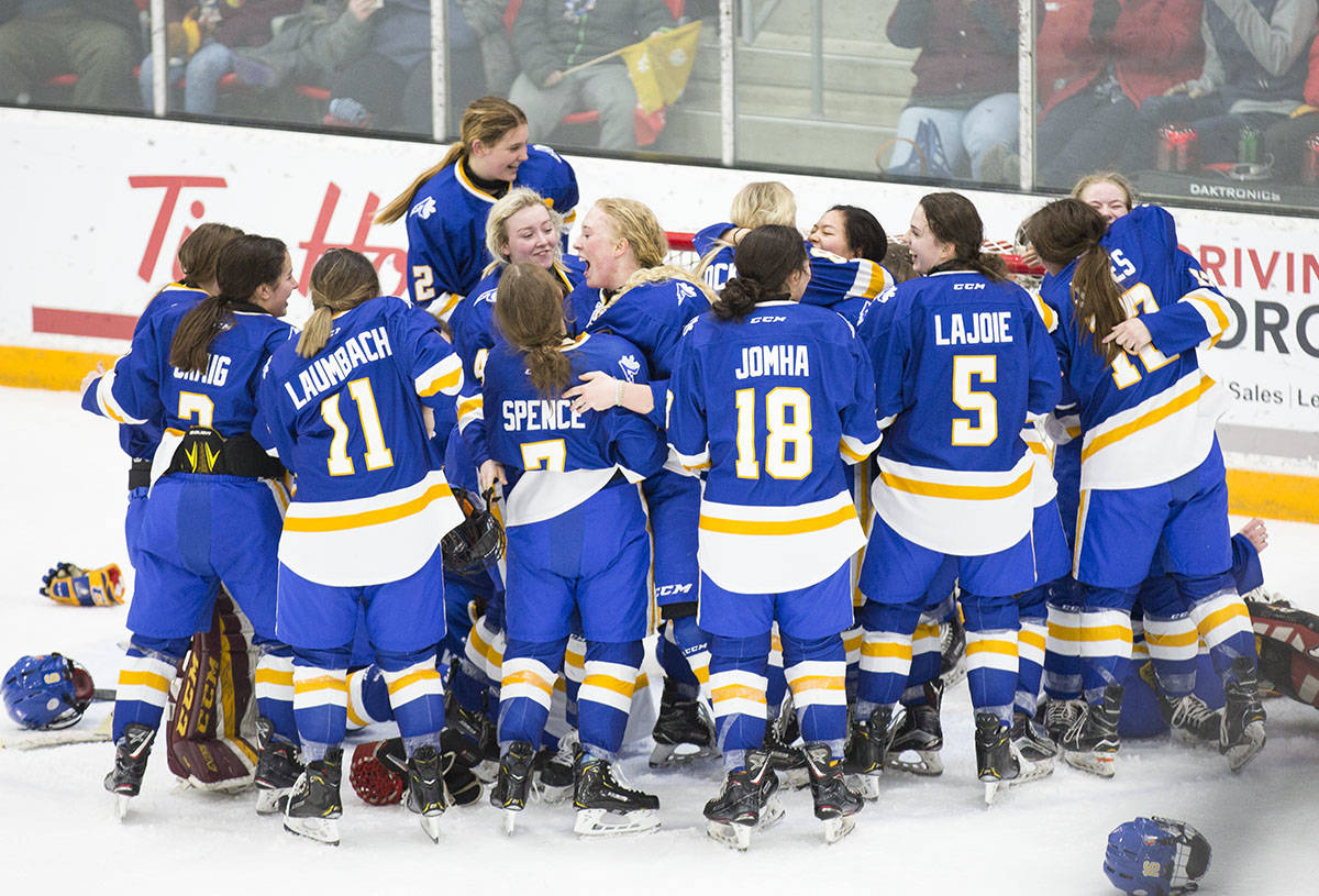 Team Alberta celebrates after beating Quebec, 2-1, and winning gold in the women’s hockey finals on Saturday afternoon at the Downtown Arena. Robin Grant/Red Deer Express