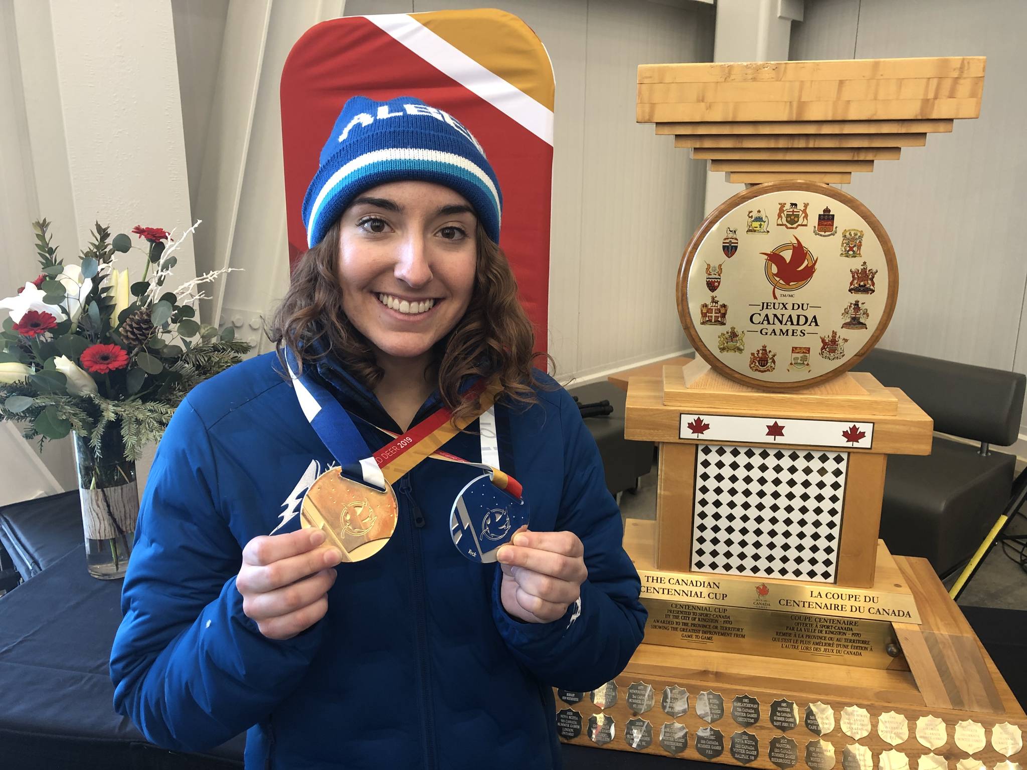 Red Deer gymnast Kalena Soehn holds up her medals beside the Centennial Cup which was awarded to Team Alberta for showing the greatest improvement from one Winter Games to the next. Robin Grant/Red Deer Exp