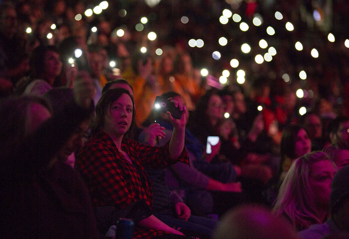 Spectators join in by holding up phone flashlights during musical performances. Robin Grant/Red Deer Express
