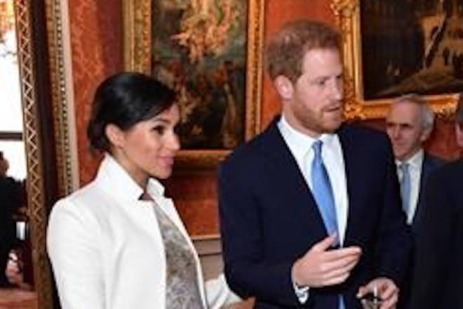 Britain’s Prince Harry and Meghan, Duchess of Sussex attend a reception at Buckingham Palace, London, Tuesday March 5, 2019, to mark the fiftieth anniversary of the investiture of the Prince of Wales. (Dominic Lipinski/Pool via AP)