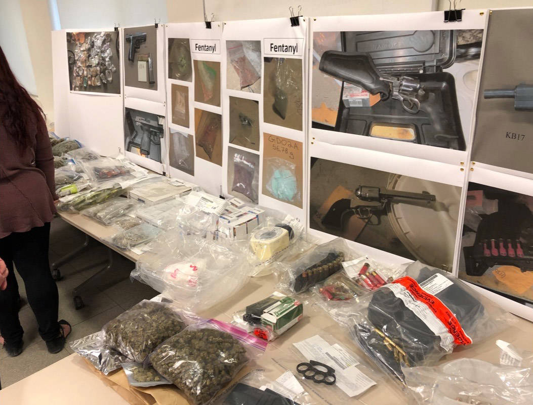Three face charges after RCMP seize drugs, guns, cash in biggest drug bust in recent Red Deer history