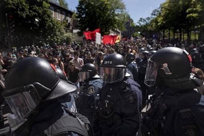 Protesters march through in Quebec City on Saturday, June 9, 2018, as the G7 summit closes. THE CANADIAN PRESS/Chris Young