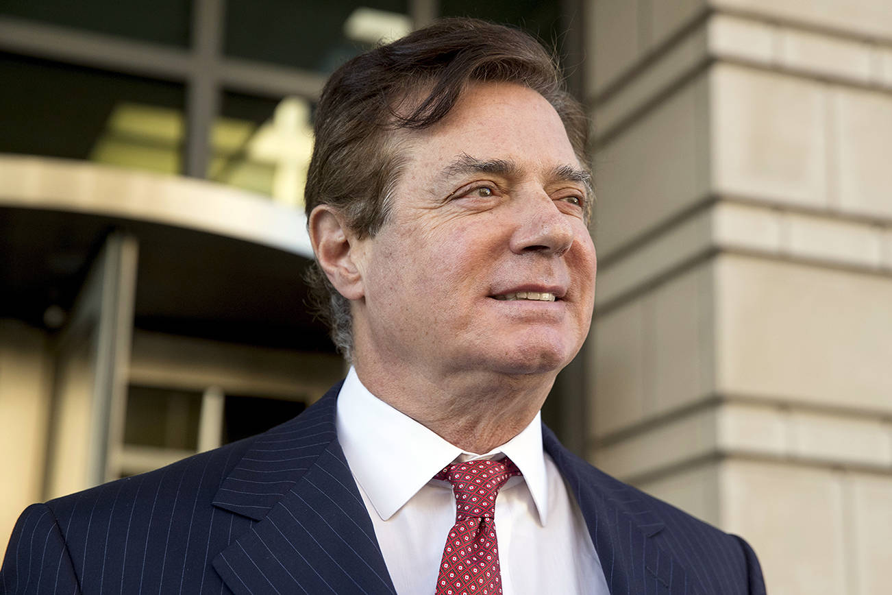 FILE - In this Nov. 2, 2017 file photo, Paul Manafort, President Donald Trump’s former campaign chairman, leaves Federal District Court in Washington. The 69-year-old Manafort is scheduled to appear Thursday in U.S. District Court in Alexandria, Virginia, where he could get 20 years under federal guidelines but his lawyers have sought a shorter sentence. Manafort was convicted of hiding from the IRS millions of dollars he earned from his work advising Ukrainian politicians. (AP Photo/Andrew Harnik)
