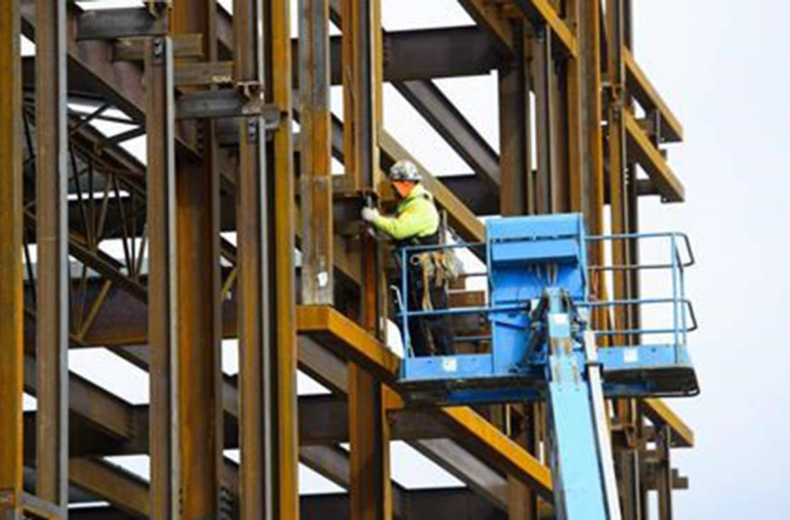 A steel worker builds a structure in Ottawa on March 5, 2018. (Sean Kilpatrick/The Canadian Press)
