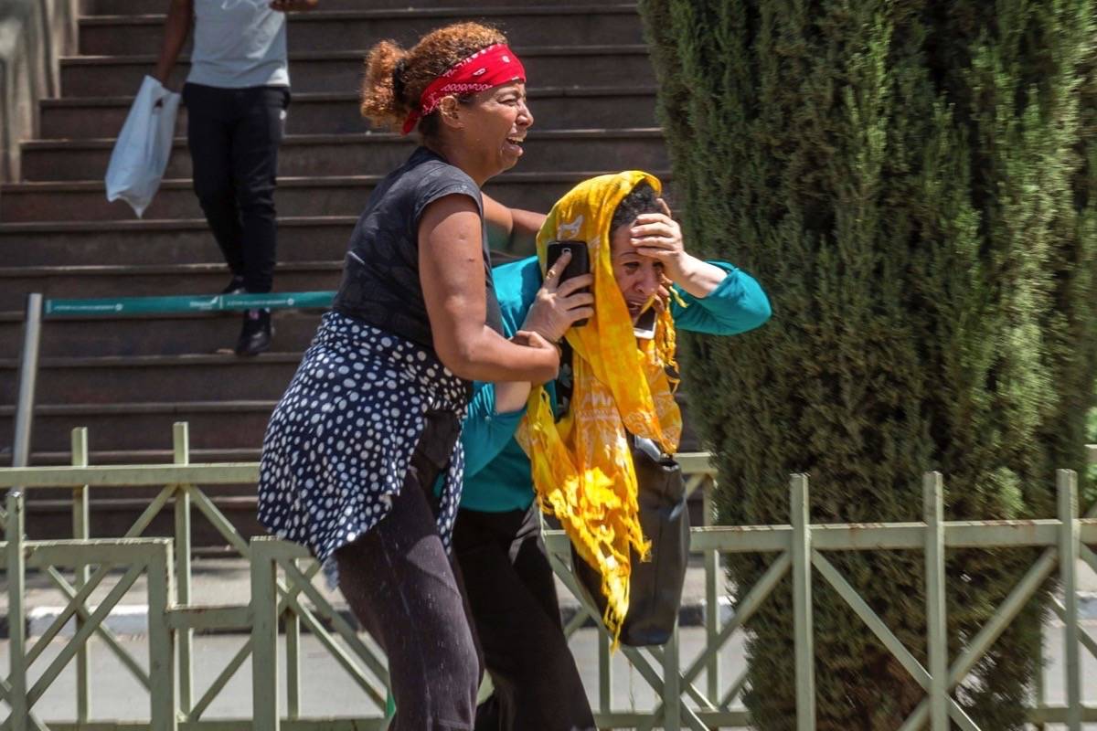 Family members of the victims involved in a plane crash react at Addis Ababa international airport Sunday, March 10, 2019. An Ethiopian Airlines flight crashed shortly after takeoff from Ethiopia’s capital on Sunday morning, killing all 157 people thought to be on board, the airline and state broadcaster said, as anxious families rushed to airports in Addis Ababa and the destination, Nairobi. (AP Photo/Mulugeta Ayene)