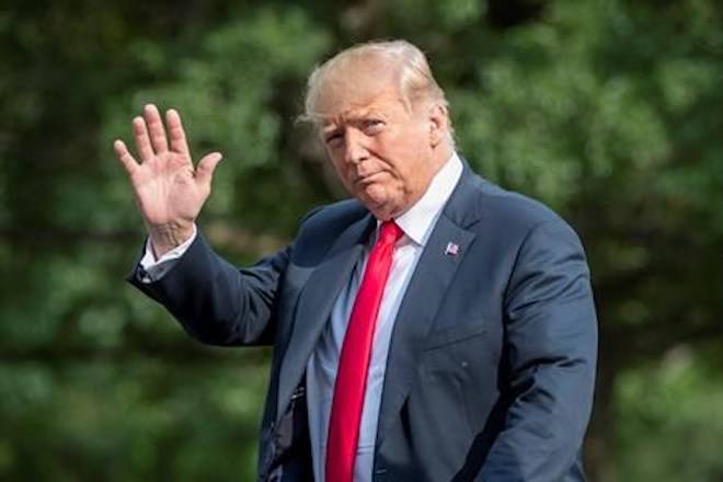 President Donald Trump waves as he arrives at the White House in Washington, Sunday, Aug. 19, 2018, after spending the weekend at his golf club in Bedminster, N.J. (AP Photo/J. Scott Applewhite)