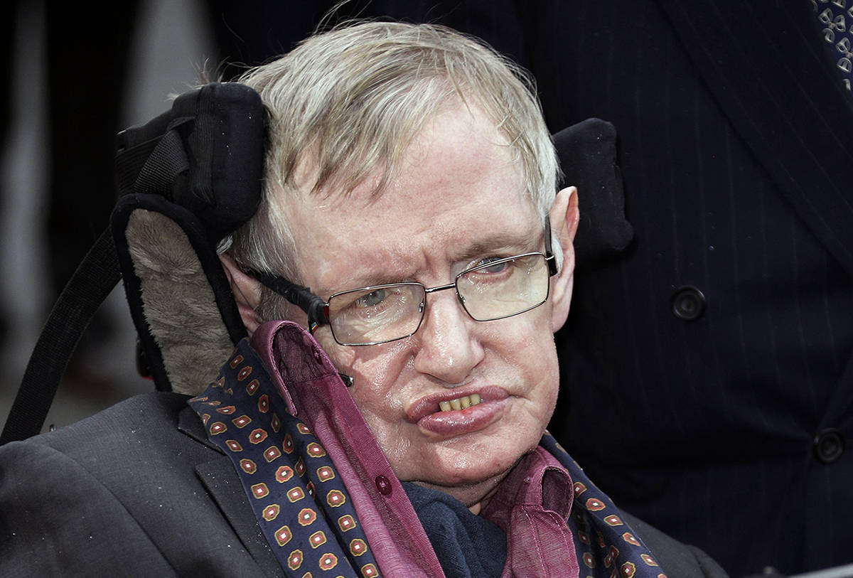 FILE - In this March 30, 2015, file photo, Professor Stephen Hawking arrives for the Interstellar Live show at the Royal Albert Hall in central London. Hawking, whose brilliant mind ranged across time and space though his body was paralyzed by disease, has died, a family spokesman said early Wednesday, March 14, 2018. (Photo by Joel Ryan/Invision/AP, File)