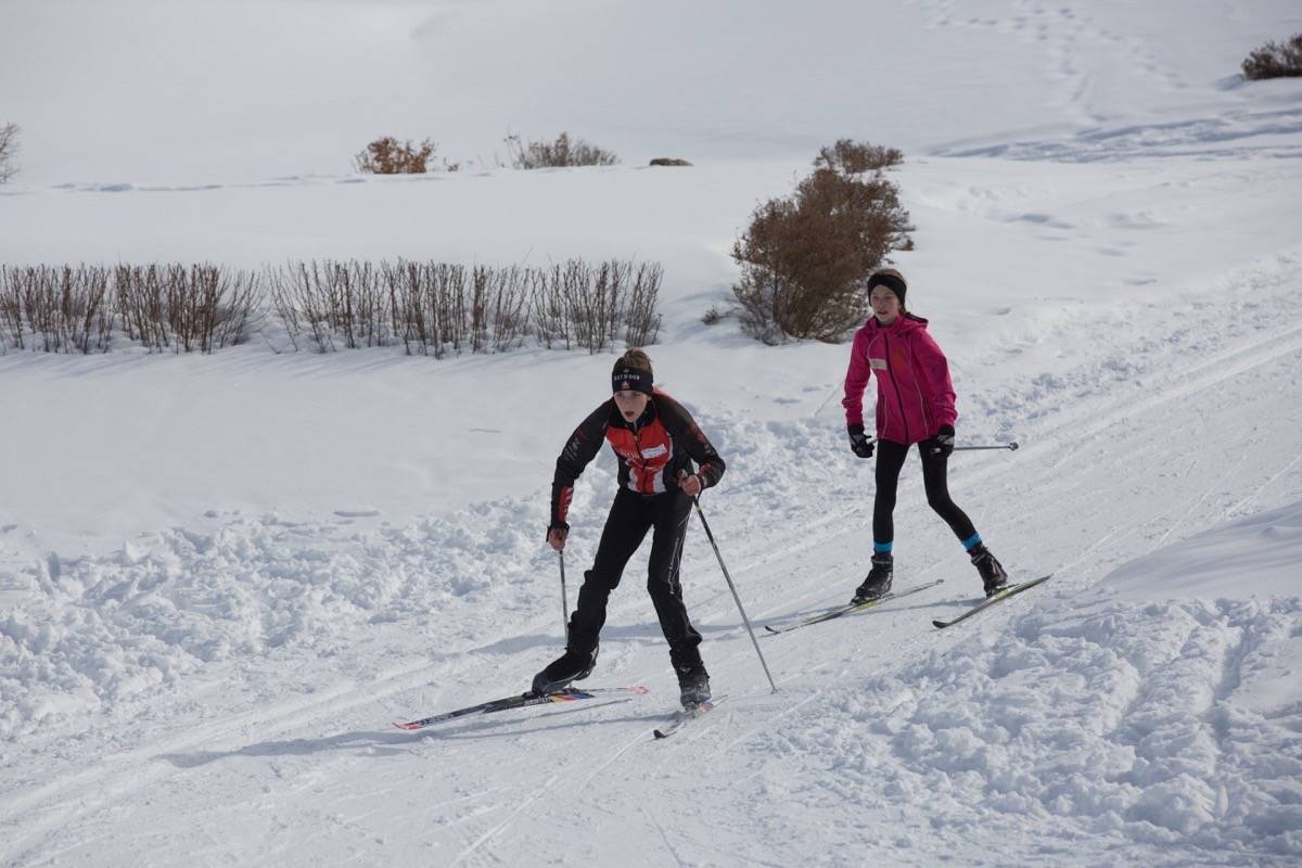 Red Deer students McKinley Penninga, left, and Ava Kay ski toward the finish line Tuesday afternoon during the Ski Loppet held at the River Bend Golf Course. Robin Grant/Red Deer Express