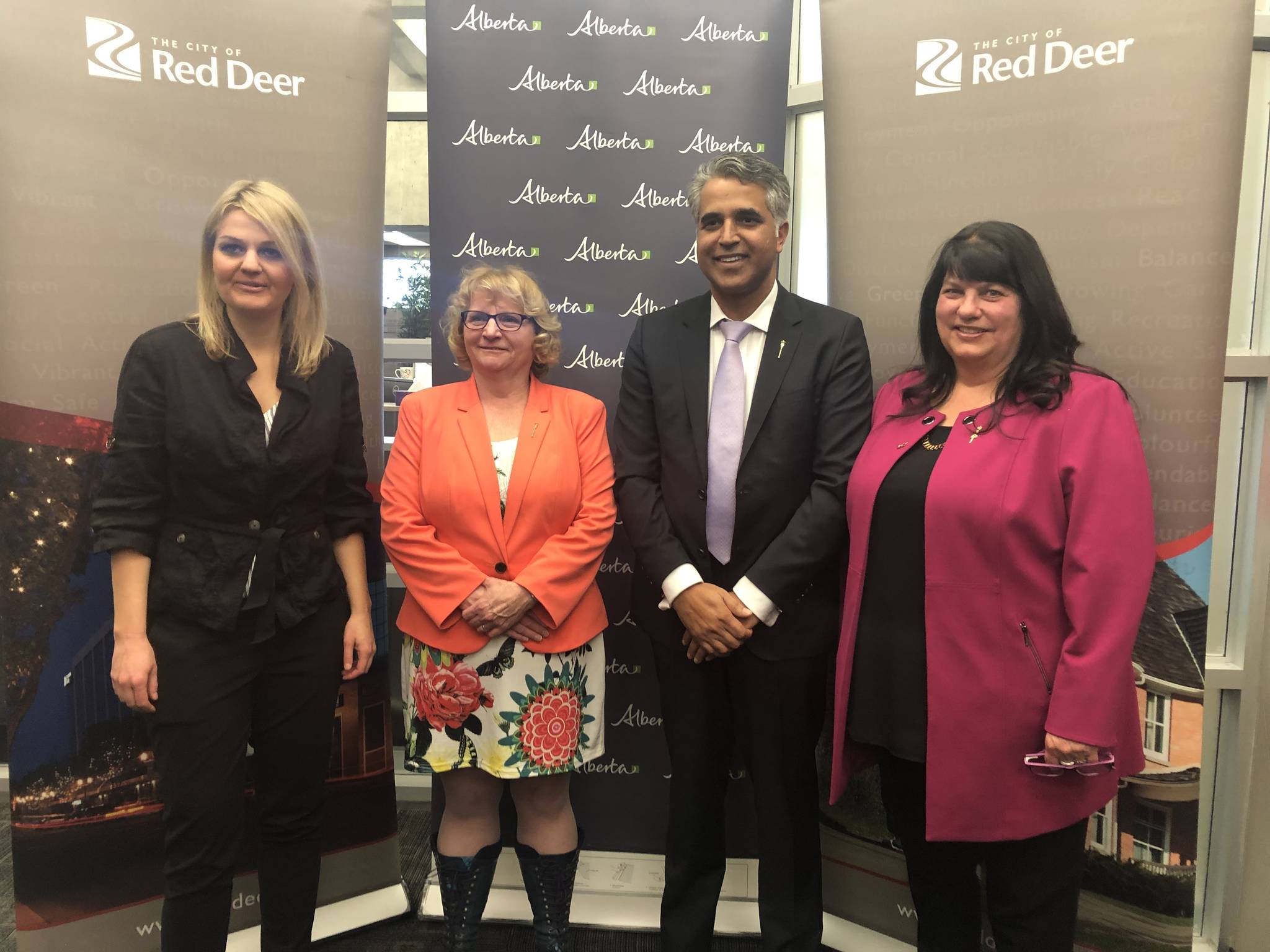 Mayor Tara Veer, MLA for Red Deer-South Barb Miller, Minister of Community and Social Services Irfan Sabir and MLA for Red Deer-North Kim Schreiner pose for a photo after the news conference announcing $7 million for a new homeless shelter. Robin Grant/Red Deer Express