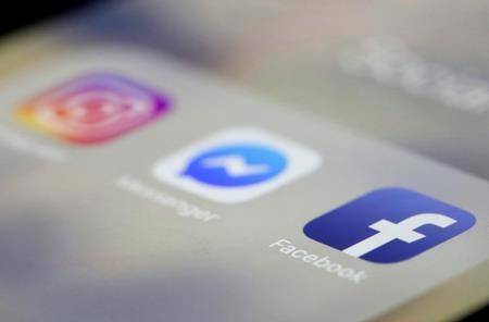 Facebook, Messenger and Instagram apps are are displayed on an iPhone on Wednesday, March 13, 2019, in New York. (AP Photo/Jenny Kane)