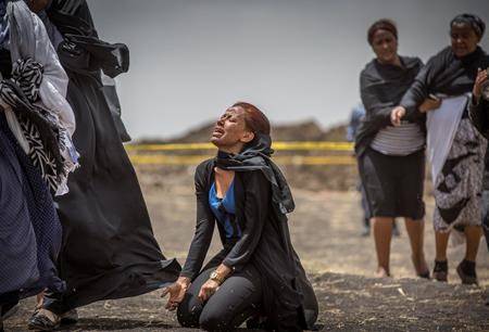 Ethiopian relatives of crash victims mourn and grieve at the scene where the Ethiopian Airlines Boeing 737 Max 8 crashed shortly after takeoff on Thursday, March 14, 2019. (AP Photo/Mulugeta Ayene)