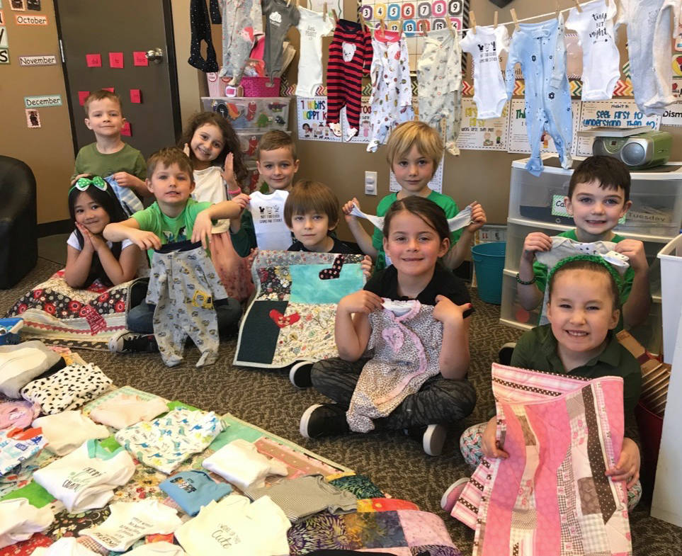 As part of their Leaders of Tomorrow Program, students from First Steps and Beyond School in Red Deer recently donated sleepers, socks and handmade quilts to the Neonatal unit at the Red Deer Regional Hospital.                                Mark Weber/Red Deer Express