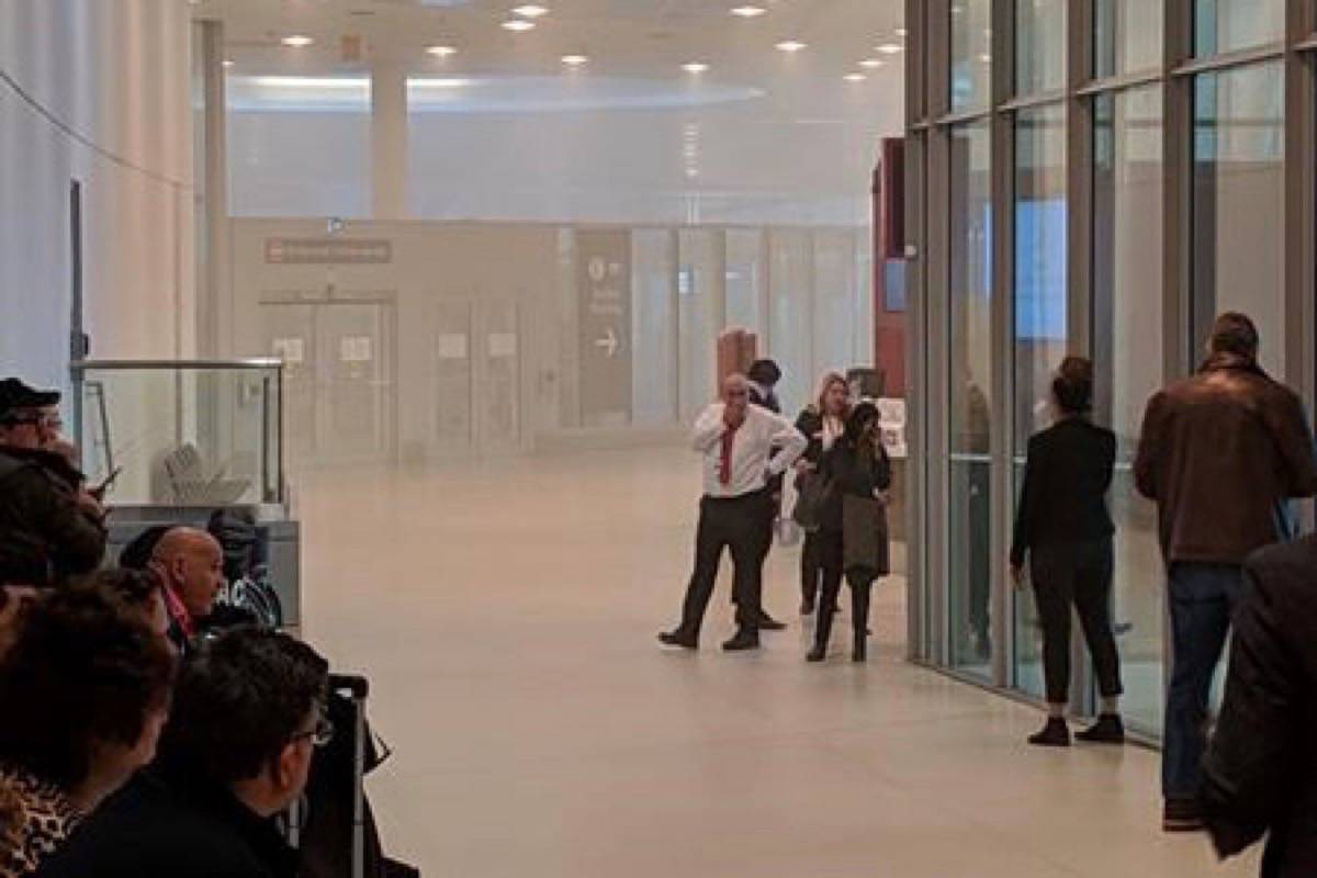 Smoke is shown inside the security screening area of Terminal 1 at Pearson International Airport in Toronto on Sunday, March 17, 2019. A fire at Canada’s busiest airport has led to cancellations, delays and a few smoke-related injuries. The blaze broke out Sunday evening in Terminal 1 at Toronto Pearson International Airport, leading authorities to evacuate the area. It was extinguished a short time later, but the airport announced in a tweet that all flights to the U.S. scheduled to depart from Terminal 1 had been cancelled. THE CANADIAN PRESS/HO - James Agnew