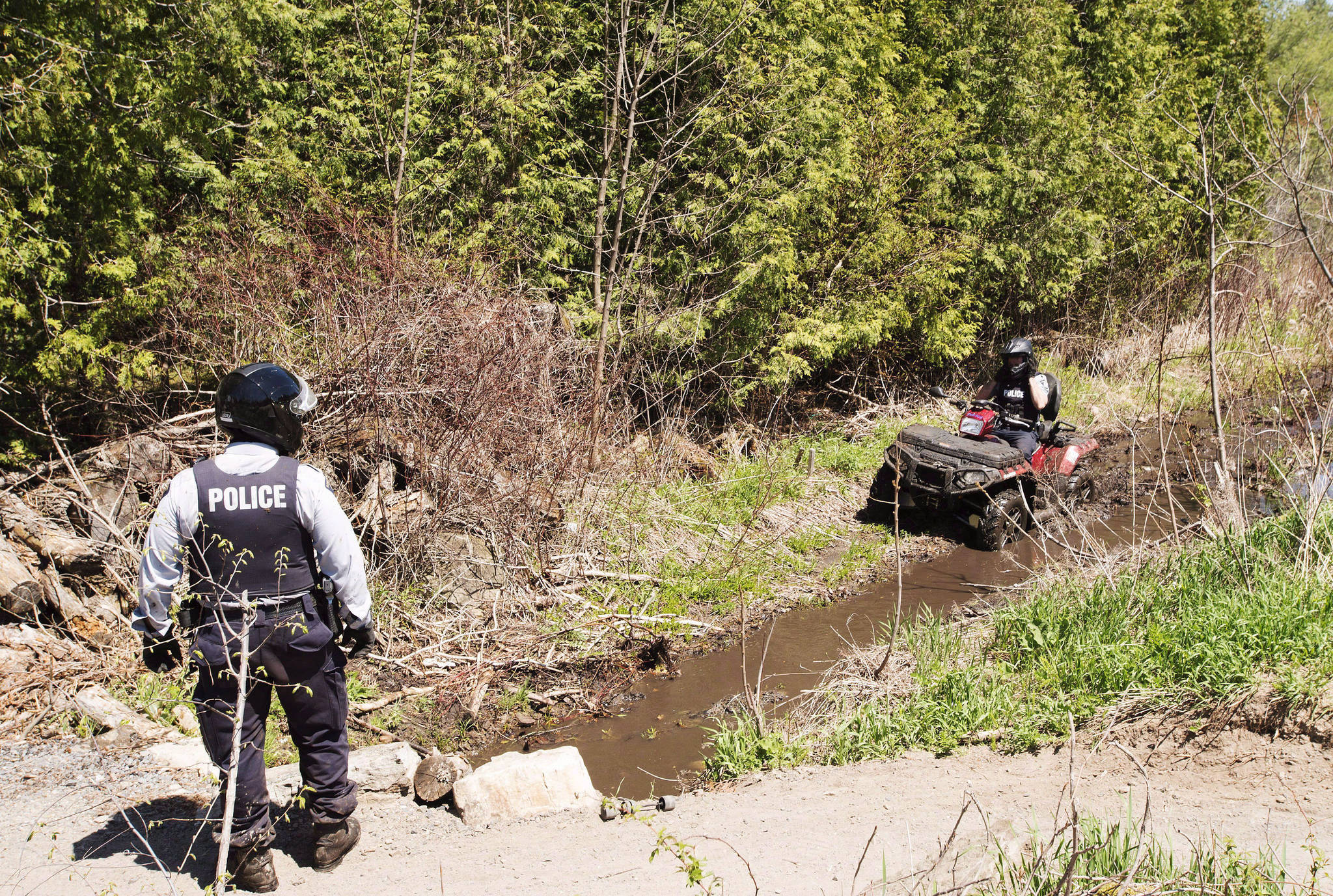 CBSA officers say they have noticed some refugee claimants who have crossed into Canada irregularly are now acting as “anchor relatives” for family members, allowing their immediate and extended family members to cross at an official border entry and not be considered irregular migrants. RCMP officers patrol the border from Champlain, N.Y., into Canada, Wednesday May 9, 2018. THE CANADIAN PRESS/Ryan Remiorz