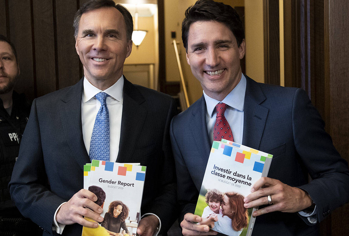 Prime Minister Justin Trudeau and Minister of Finance Bill Morneau arrive in the Foyer of the House of Commons to table the Budget, on Parliament Hill in Ottawa on Tuesday, March 19, 2019. (Justin Tang/The Canadian Press)