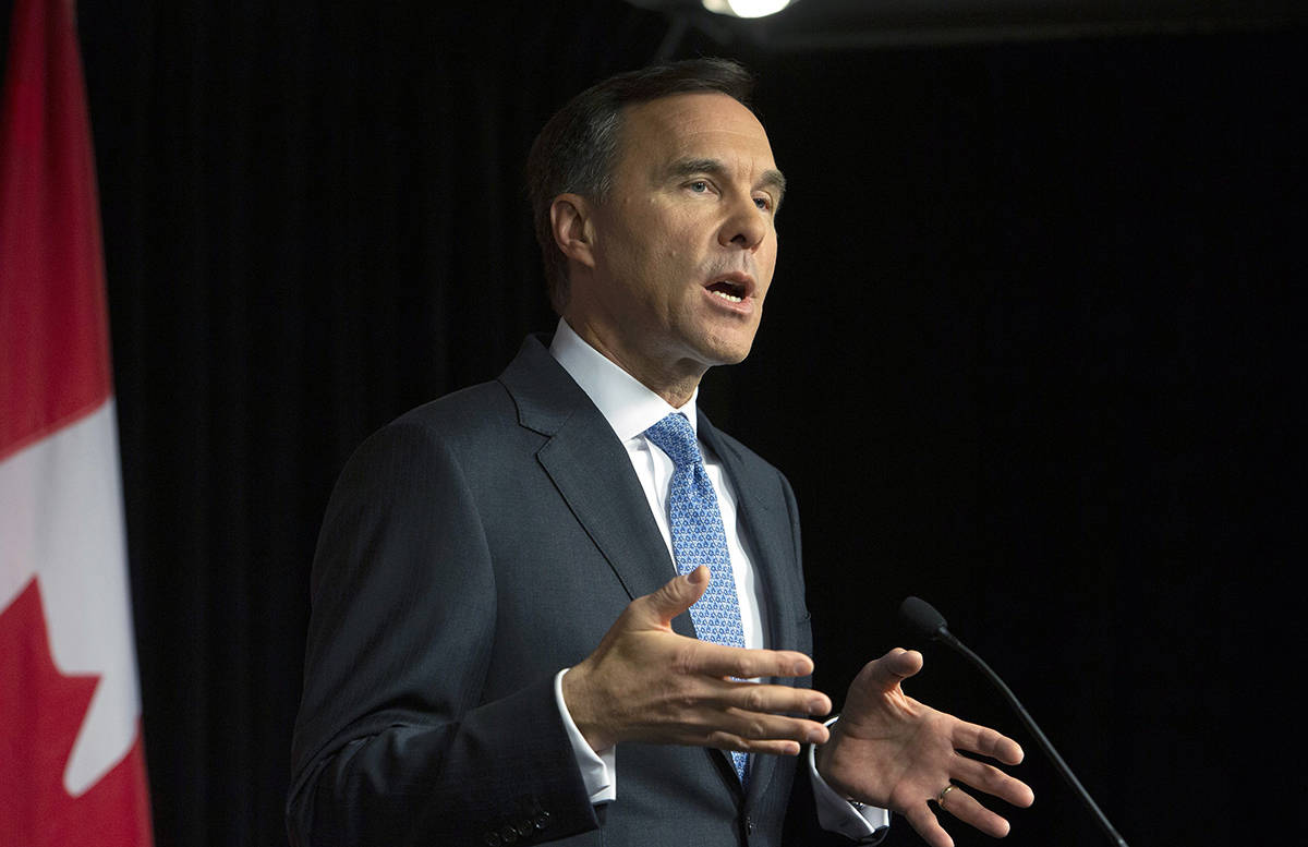 Minister of Finance Bill Morneau holds a news conference at a lockup session with reporters before the release of the federal budget in the House of Commons on Parliament Hill in Ottawa on Tuesday, March 19, 2019. (Fred Chartrand/The Canadian Press)