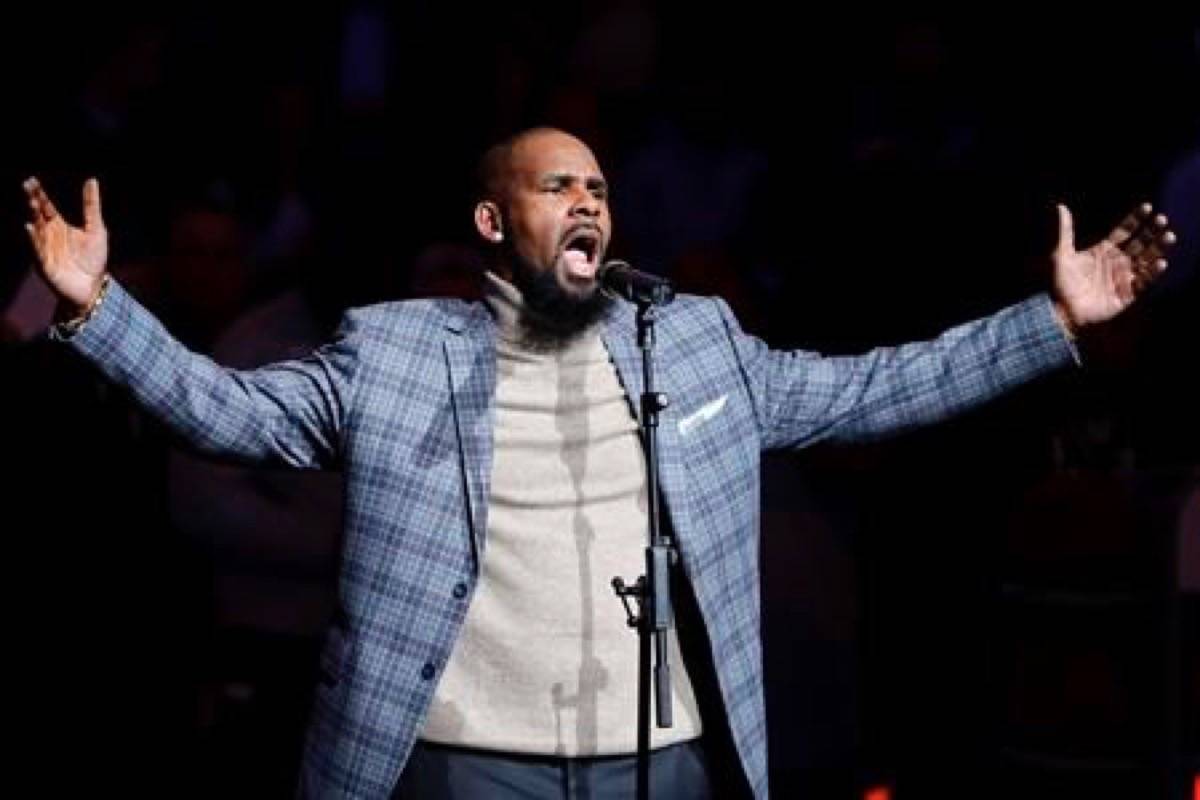 FILE - In this Nov. 17, 2015, file photo, musical artist R. Kelly performs the national anthem before an NBA basketball game between the Brooklyn Nets and the Atlanta Hawks in New York. (AP Photo/Frank Franklin II, File)