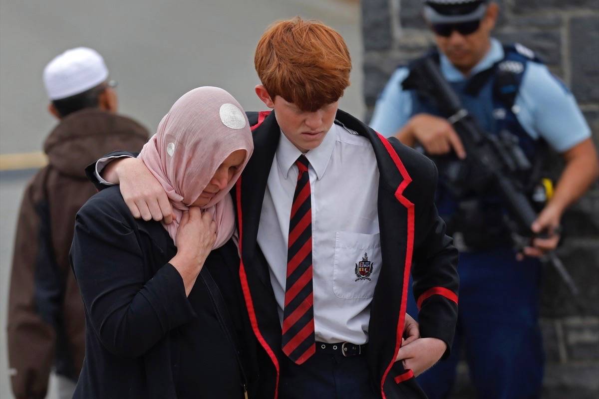 Mourners leave the cemetery after the burial service for a victim of the Friday March 15 mosque shootings at the Memorial Park Cemetery in Christchurch, New Zealand, Thursday, March 21, 2019. (AP Photo/Vincent Yu)