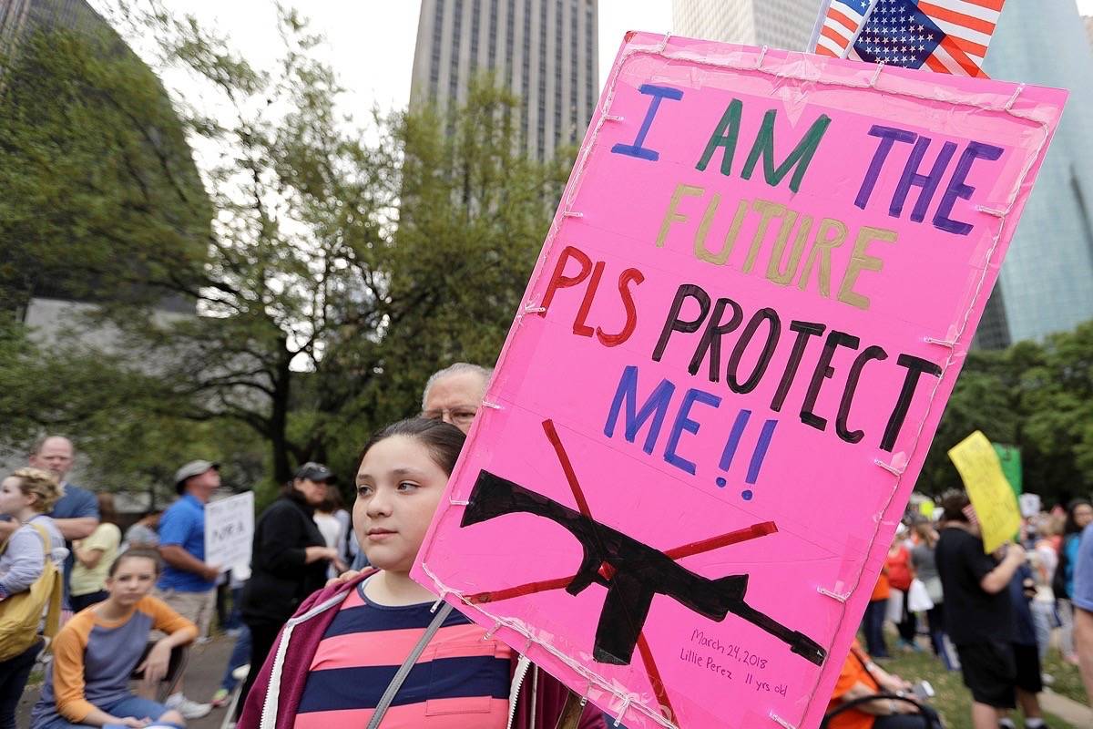 Lillie Perez, 11, holds a sign during a “March for Our Lives” protest for gun legislation and school safety Saturday, March 24, 2018, in Houston. Students and activists across the country planned events Saturday in conjunction with a Washington march spearheaded by teens from Marjory Stoneman Douglas High School in Parkland, Fla., where over a dozen people were killed in February. (AP Photo/David J. Phillip)